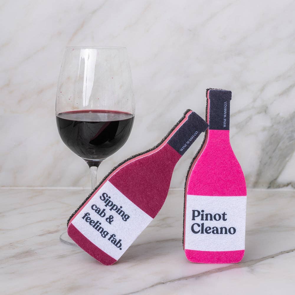 Pink pinot cleano swine shaped sponge with a glass of red wine